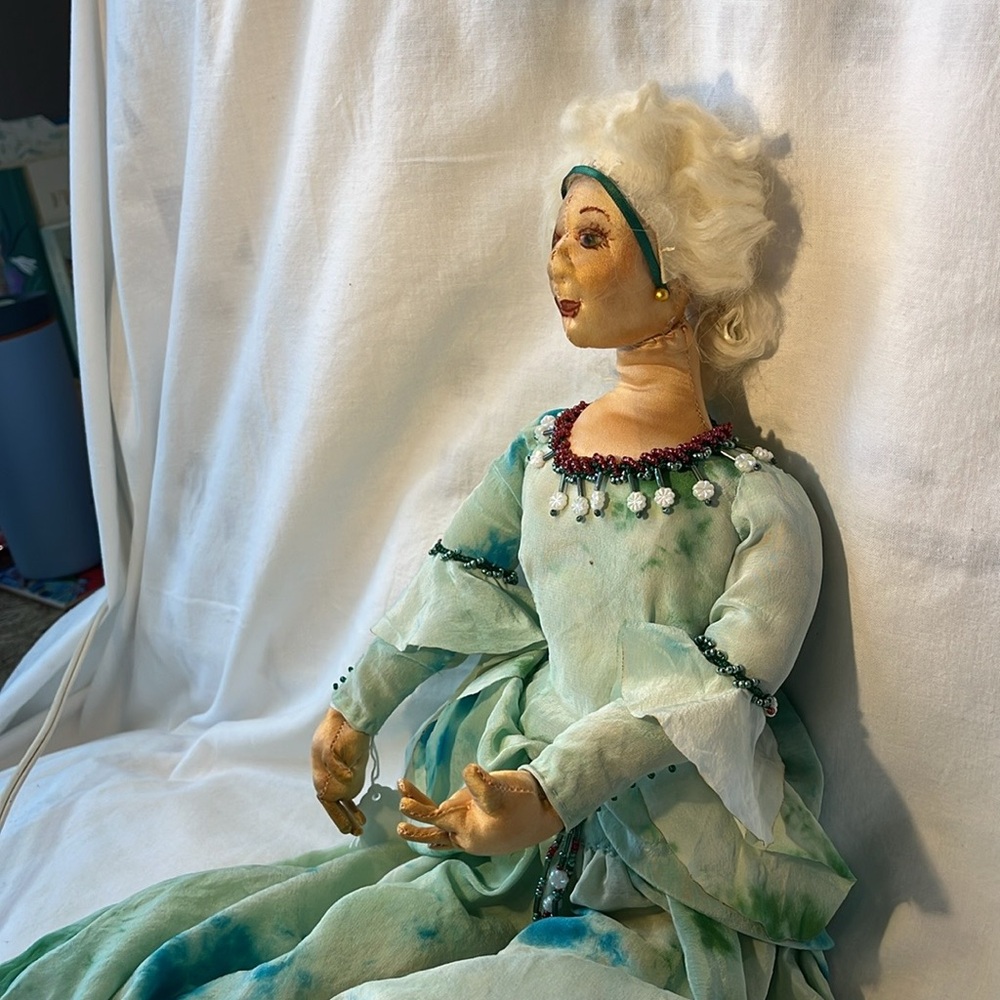 Handmade vintage 18” doll. Silk and animal hair. Turquoise beaded dress.
